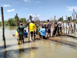Bhabinkamtibmas Polsek Malangke Barat Bersama Warga Gotong Royong Perbaiki Tanggul Jebol di Desa Pombakka